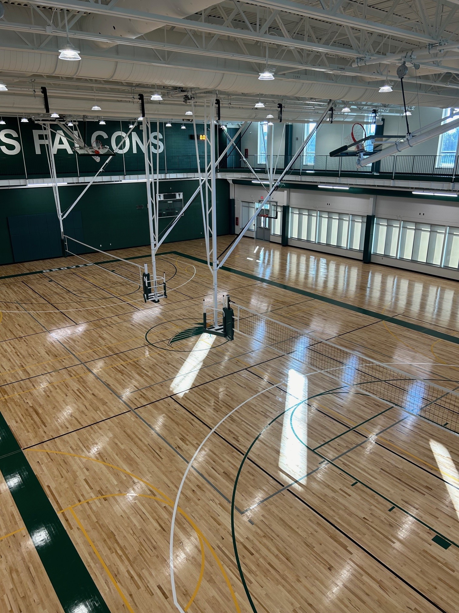 Basketball backstops in multi-court gymnasium — Groves High School